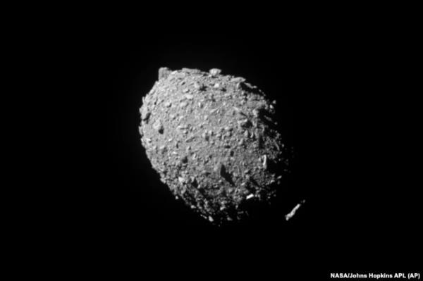 FILE - This image provided by NASA shows the asteroid Dimorphos, captured by NASA’s DART mission just two seconds before the spacecraft struck its surface, Sept. 26, 2022.