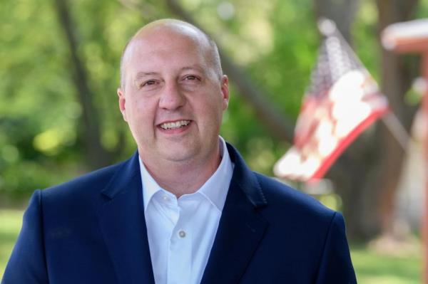 A man in a suit, Curtis Hertel, candidate for Congress in Michigan’s 7th District and former State Senator 23rd District